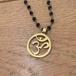 Om Gold and Black Pendant Necklace